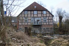 Wassermühle Eickhof - Ansicht Giebel Wasserseite von der Warnow auf Mühle 2024
